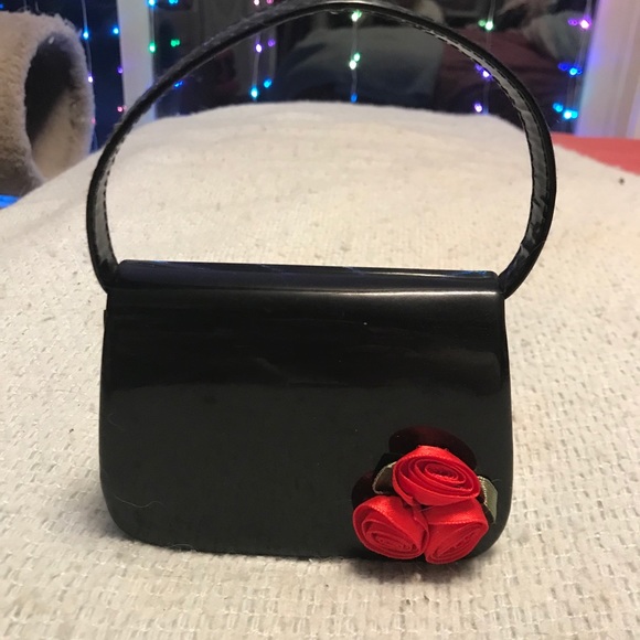 Black patent leather mini purse with rose accents. - Picture 1 of 2